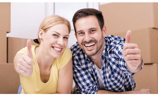 couple happy thumbs up move house boxes